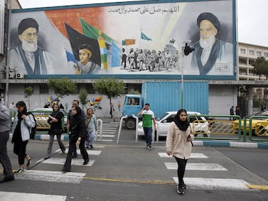 A mural of Iranian supreme leader Ayatollah Ali Khamenei, left, and late leader Ayatollah Ruhollah Khomeini, in Tehran. Last month, Iran and Israel directly attacked each other's territory for the first time.