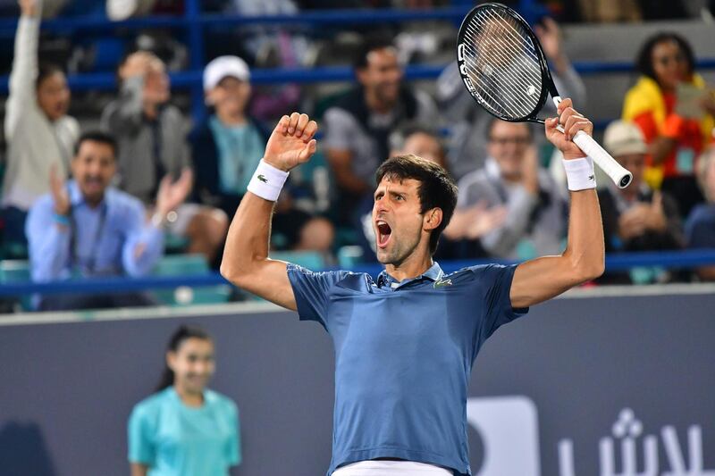 Serbia's Novak Djokovic celebrates his victory during the Mubadala World Tennis Championship 2018 in Abu Dhabi, on December 29, 2018. Djokovic won a fourth Mubadala World Tennis Championship title, coming back from a set down to beat Kevin Anderson 4-6, 7-5, 7-5. / AFP / GIUSEPPE CACACE
