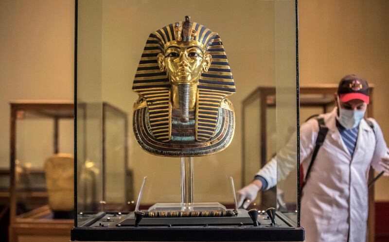 A worker disinfects a gallery of the ancient Egyptian Pharaoh Tutankhamun at the Egyptian Museum in Cairo's landmark Tahrir Square. AFP