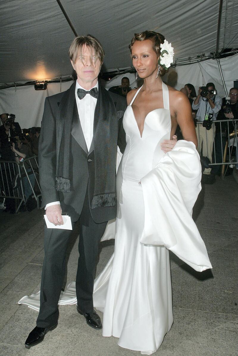 NEW YORK - APRIL 28:  (US TABS AND HOLLYWOOD REPORTER OUT) Musician David Bowie and wife model Iman arrive at the Metropolitan Museum of Art Costume Institute Benefit Gala sponsored by Gucci April 28, 2003 at The Metropolitan Museum of Art in New York City. (Photo by Evan Agostini/Getty Images)