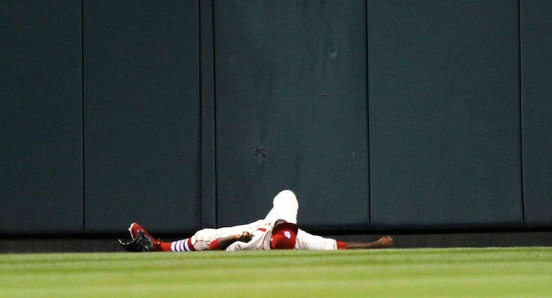 St. Louis Cardinals' Dexter Fowler is injured after hitting the wall during a baseball game at Busch Stadium. Bill Boyce / AP Photo