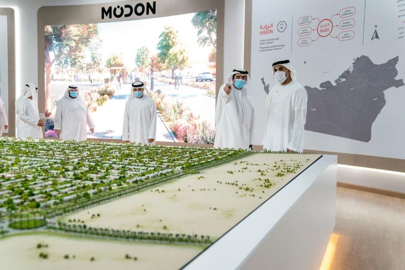 Sheikh Khalid bin Mohamed, member of the Executive Council and chairman of Abu Dhabi Executive Office, looks over the master plan for Baniyas North at the sales centre on Tuesday. Wam