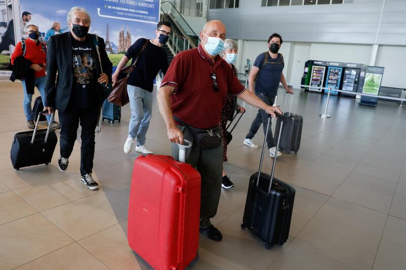 People arrive at Faro Airport from Manchester on the first day that Britons were allowed to enter Portugal without needing to quarantine. Reuters