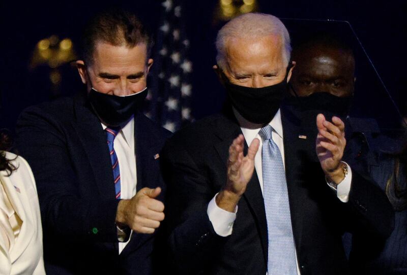 Democratic 2020 U.S. presidential nominee Joe Biden and his son Hunter celebrate onstage at his election rally, after the news media announced that Biden has won the 2020 U.S. presidential election over President Donald Trump, in Wilmington, Delaware, U.S., November 7, 2020. REUTERS/Jim Bourg