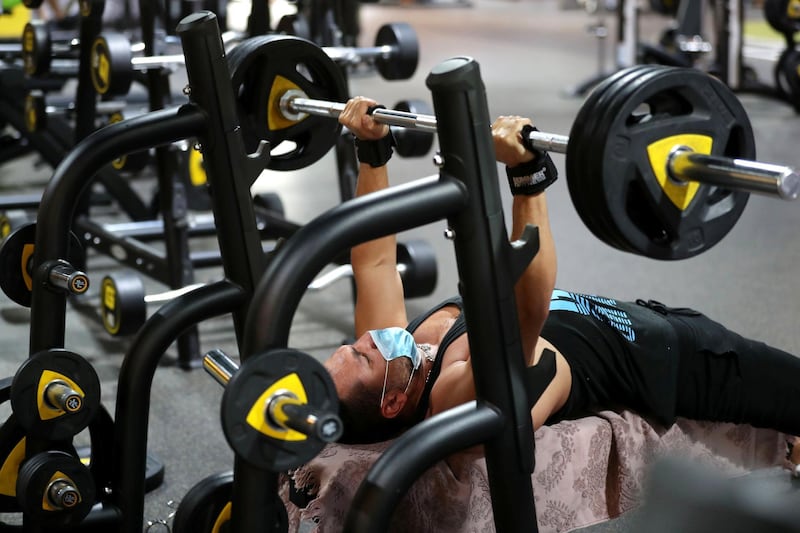 Dubai, United Arab Emirates - Reporter: Kelly Clark: News. Ahmed Ali does some weights at GymNation in Al Quoz as gyms across Dubai start to open. Wednesday, May 27th, 2020. Dubai. Chris Whiteoak / The National