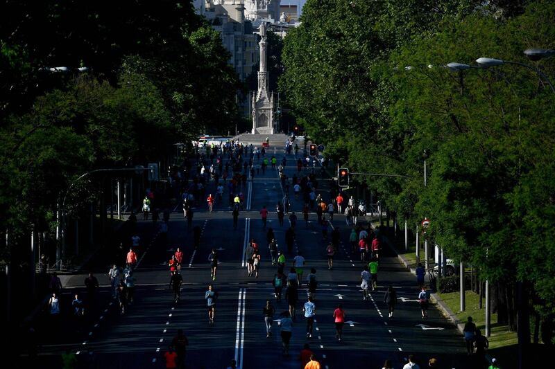 People exercice in Madrid during the hours allowed by the government to exercise, amid the national lockdown to prevent the spread of the COVID-19 disease. AFP
