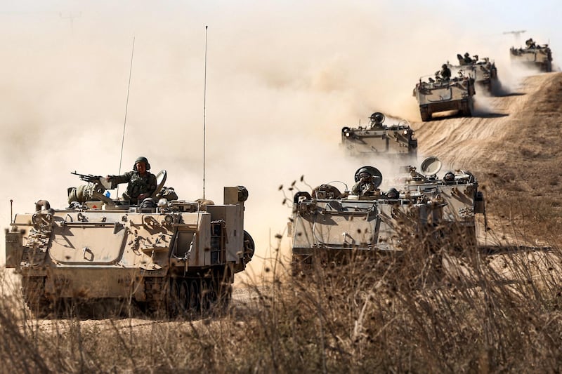 Israeli army infantry fighting vehicles deploy along the border with the Gaza Strip in southern Israel. AFP
