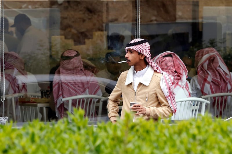 A man smokes outside a singles only restaurant in Riyadh, Saudi Arabia. AP Photo