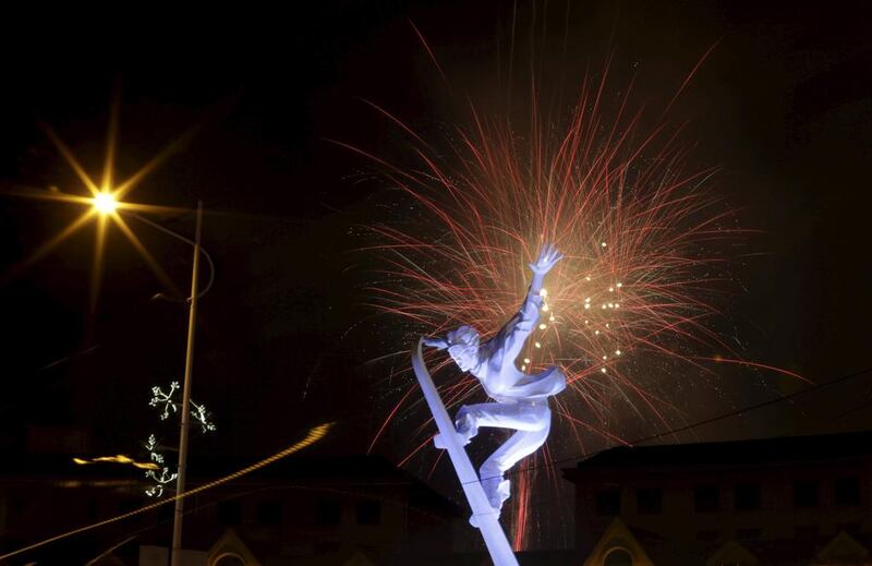 Fireworks explode behind a skiing sculpture to celebrate Beijing being chosen to host the 2022 Winter Olympic. Jason Lee / Reuters