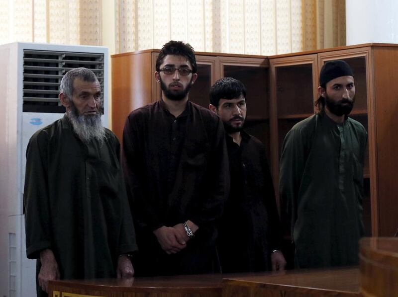 Four Afghan men look on in court during their trial in connection with the killing of a 27-year-old woman who was lynched by a mob after being falsely accused of burning the Qura. The four men were sentenced to death in Kabul, Afghanistan on May 6, 2015. Mohammad Ismail/Reuters