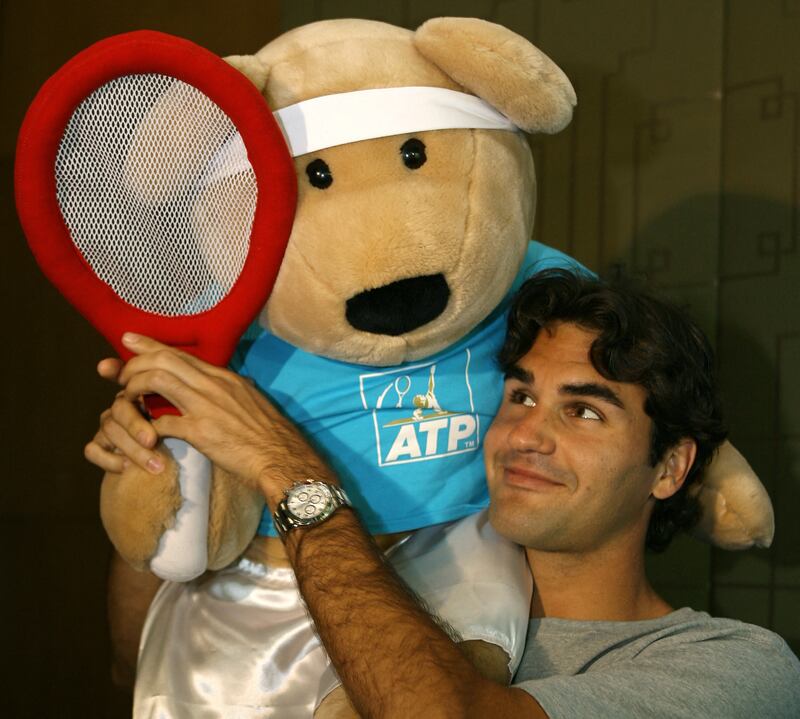 Unicef goodwill ambassador Roger Federer with a 'Feder-bear Beanie Baby' in Melbourne on January 18, 2007. AFP
