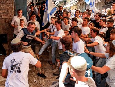 Ultra-nationalist Israelis attack Palestinian freelance journalist Saif Kwasmi during the Flag Day march. AFP