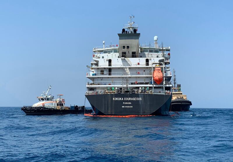 TOPSHOT - A picture taken during a guided tour by the US Navy (NAVCENT) shows the Japanese oil tanker Kokuka Courageous off the port of the Gulf emirate of Fujairah on June 19, 2019. The Japanese tanker attacked in the Gulf of Oman last week was damaged by a limpet mine resembling Iranian mines, the US military in the Middle East said today. Commander Sean Kido of the US Navy told reporters that the US military has recovered biometric information of the assailants on the Japanese ship including "hand and finger prints." Two oil tankers were damaged in twin attacks close to the Iranian coast on June 13, just outside the strategic Strait of Hormuz.
 / AFP / Mumen KHATIB
