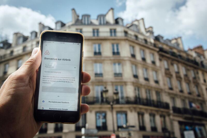 The Airbnb Inc. app is displayed on a Apple Inc. smartphone near residential apartments in this arranged photograph in Paris, France, on Wednesday, June 10, 2020. France slammed the U.S. over its probe into digital taxes that are being considered by a number of countries, saying it contradicts Washington’s call for unity among leading economies. Photographer: Cyril Marcilhacy/Bloomberg