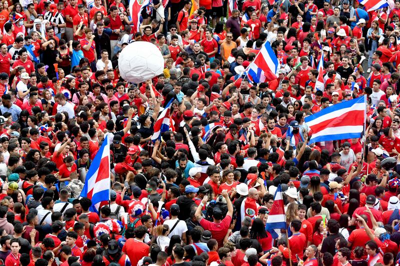 Costa Rican football fans celebrate World Cup qualification in the streets of San Jose. AFP