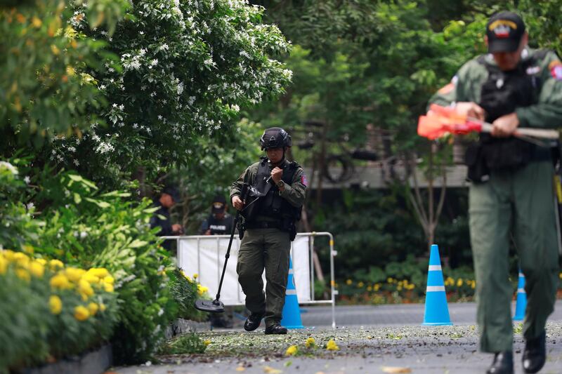 Police Explosive Ordnance Disposal (EOD) officers work following a small explosion at a site in Bangkok, Thailand. REUTERS