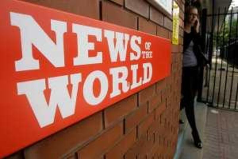 A sign for the News of the World newspaper is seen outside the offices of its owner News International Ltd., in London, Thursday July 9, 2009.  Britain's most senior policeman ordered an inquiry Thursday into claims that journalists from the tabloid owned by media mogul Rupert Murdoch illegally hacked into the mobile phones of hundreds of celebrities and politicians.  Lawmakers also demanded answers after The Guardian reported that the News of the World _ the country's most popular Sunday paper _ paid private investigators to obtain voice mail messages, private phone numbers, bank statements and other information about figures including Gwyneth Paltrow, George Michael and some of the country's most senior politicians.  (AP Photo/Matt Dunham) *** Local Caption ***  LMD105_Britain_Newspaper_Privacy.jpg