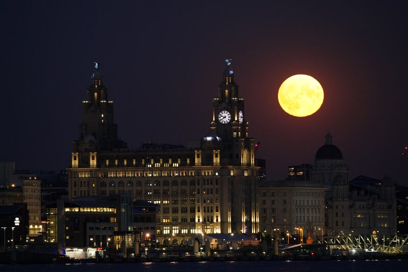 A UK supermoon illuminates the Royal Liver Building in Liverpool. PA