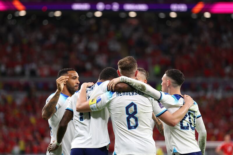 Marcus Rashford celebrates with his England teammates  after scoring the third goal in the 3-0 Group B win against  Wales at Ahmad Bin Ali Stadium in Doha on November 29, 2022. Getty