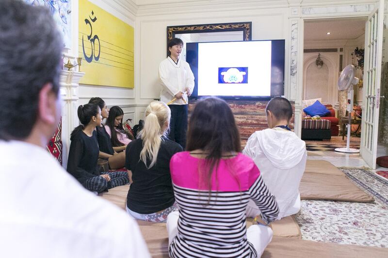 DUBAI, UNITED ARAB EMIRATES, 16 JULY 2017. 

Inside Taijitu House of Om (THO), Master Daae leads a Brain Sensitizing: Brain Energy Awareness Training session.

Wiso Barakeh, the founder of THO, shares his home space by offering free activities such as meditations, yoga, NLP, life coaching, sound healing, body movement  through the sound of traditional instruments, knowledge sharing through book clubs and soul cinema etc.

The house is a shared space for alternative healers, thinkers, mind body and soul specialists, as well as people interested in cultural evolution and self-development. 

(Photo by Reem Mohammed / The National)

Reporter: Haneen Dajani 
Section: NA
