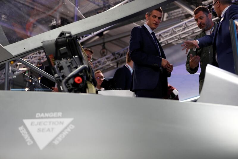 British defence minister Gavin Wiliamson looks at the cockpit of a model of Tempest. Reuters