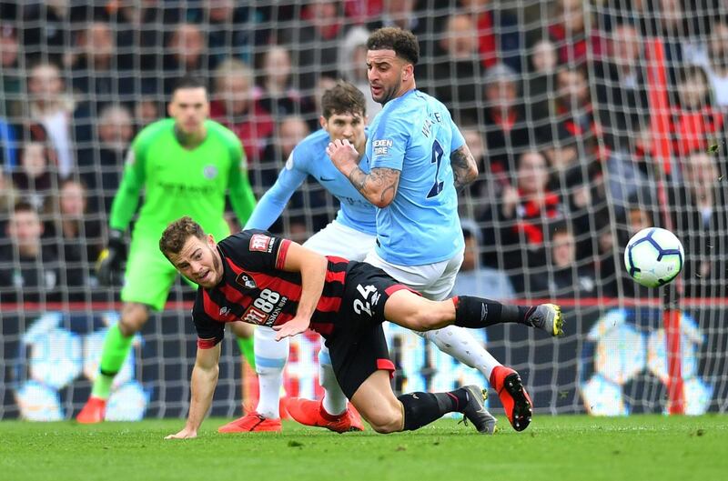 Bournemouth's Ryan Fraser in action with Walker. Reuters