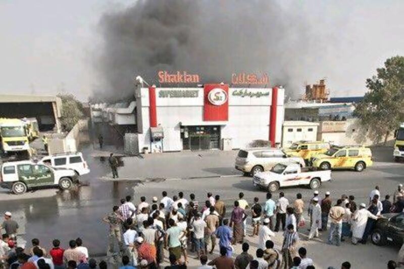 Firefighters battle the blaze at the warehouse of Shaklan Supermarket.