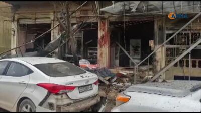 An image grab taken from a video published by Hawar News Agency (ANHA) on January 16, 2019, shows the aftermath of a suicide attack in the northern Syrian town of Manbij. 


 A suicide attack targeting US-led coalition forces in the flashpoint northern Syrian city of Manbij killed a US serviceman and 14 other people today, a monitor said.
 / AFP / ANHA / -
