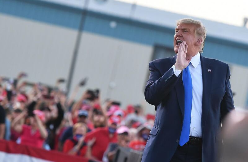 US President Donald Trump speaks to supporters as he makes his way off stage at the end of a rally at Carson City Airport in Carson City, Nevada.  AFP