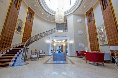 The sweeping staircase in a grand entrance hallway certainly makes a statement. Courtesy The Urban Nest