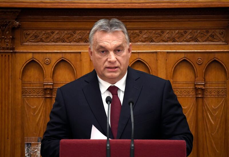 Hungarian Prime Minister Viktor Orban, front, delivers his address during the opening of the autumn session of the Hungarian Parliament lead by Speaker of the Parliament Laszlo Kover, center back, in Budapest, Hungary, Monday, Sept. 17, 2018. (Tamas Kovacs/MTI via AP)