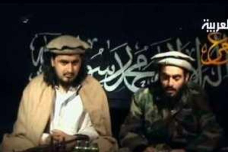An image grab taken from a videotape broadcast on January 9, 2010 by the Dubai-based Al-Arabiya news network shows Jordanian Humam Khalil Abu-Mulal al-Balawi (R), who blew himself up in Afghanistan, reading a statement as he sits next to Taliban leader Hakimullah Mehsud at an undisclosed location. Balawi, who killed seven CIA agents and his Jordanian handler, said in the video broadcast the act he was planning was for revenge. "We tell our emir Baitullah Mehsud we will never forget his blood. It is up to us to avenge him in and outside America," Humam Khalil Abu-Mulal al-Balawi said about a Taliban leader killed in a US attack in August. AFP PHOTO/HO/AL-ARABIYA == RESTRICTED TO EDITORIAL USE == *** Local Caption ***  586142-01-08.jpg