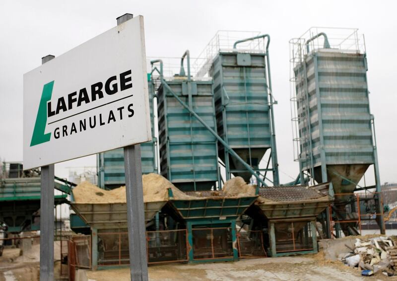 FILE - In this Feb.18, 2009 file photo, a Lafarge facility is pictured in Paris, France. Three lawyers including Amal Clooney say a group of Yazidi women they represent, who are victims of the Islamic State group's crimes in Iraq and Syria, is joining a criminal case against French cement company Lafarge. (AP Photo/Thibault Camus, File)