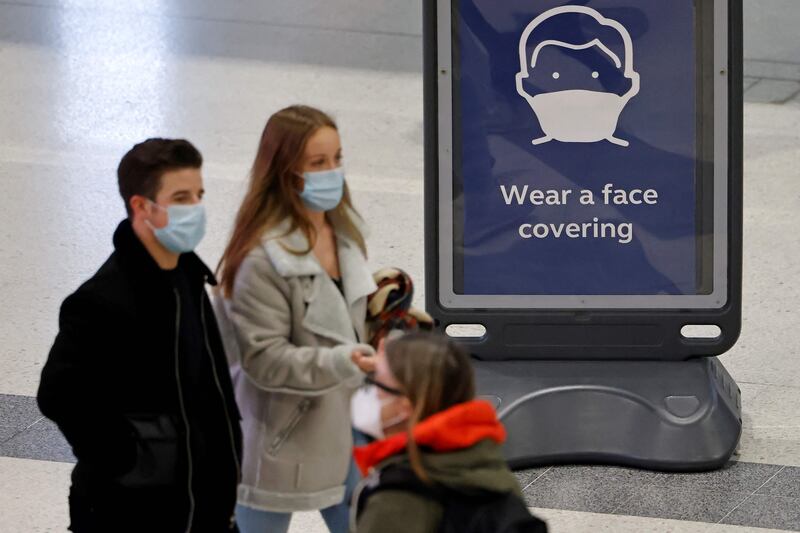 Pedestrians wearing face coverings to combat the spread of Covid-19 at Liverpool Street train station in central London. AFP