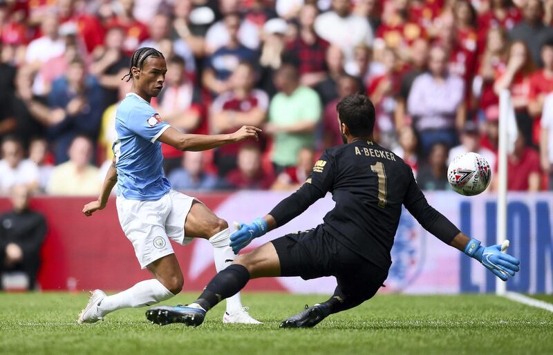 LONDON, ENGLAND - AUGUST 04: Leroy Sane of Manchester City shoots as he is closed down by Alisson Becker of Liverpool during the FA Community Shield match between Liverpool and Manchester City at Wembley Stadium on August 04, 2019 in London, England. (Photo by Laurence Griffiths/Getty Images)