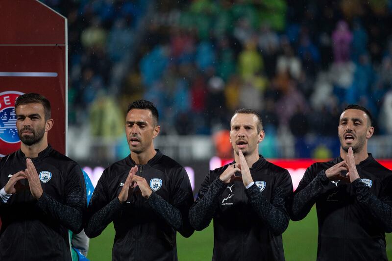 Israel's players sing their national anthem ahead of the Euro 2024 Group I qualifier against Kosovo. AFP