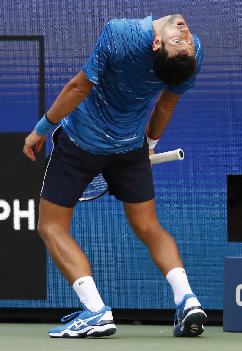 Novak Djokovic reacts after losing a point. EPA