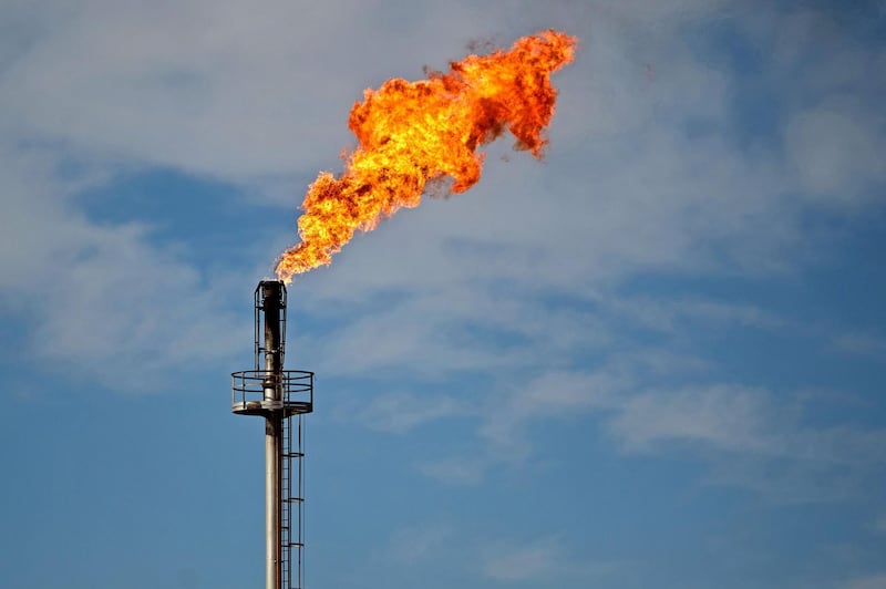 (FILES) This file photo shows a view of a gas flare in Anelo, Argentina, in the Vaca Muerta Formation, on November 28, 2019. In the midst of a delicate debt restructuring, Argentina is holding its breath as the coronavirus pandemic coupled with an oil price slump poses a perfect storm for its economy. - 
 / AFP / Emiliano Lasalvia
