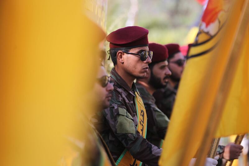 Members of the Iraqi Hezbollah Brigades, part of the Hashed al-Shaabi paramilitary units, carry flags during a ceremony in Baghdad on June 21, 2018, commemorating fellow members who were killed in air raids 4 days earlier. The air strike that hit targets in eastern Syria near the frontier with Iraq where forces on the ground are battling Islamic State Group (IS) remnants, reportedly left more than 50 people dead, state media and a Britain-based monitor said.
Both Damascus and the Iran backed-Hashed have blamed the US-led coalition for the raids, but the coalition and the Pentagon denied any involvement.


 / AFP / AHMAD AL-RUBAYE
