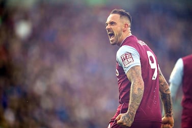 Aston Villa's John McGinn picks up a flare that was thrown onto the field after Danny Ings (not pictured) celebrates scoring their side's second goal of the game during the Premier League match at the American Express Community Stadium, Brighton. Picture date: Sunday November 13, 2022.