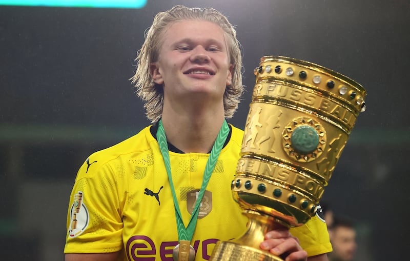 Erling Haaland celebrates with the trophy after winning the German Cup final in May 2021. AFP