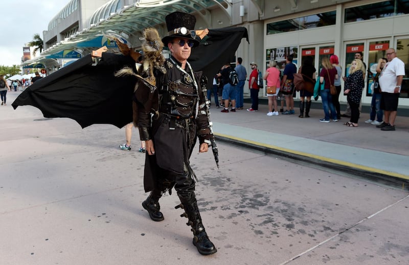 Dean LeCrone, of San Diego, wears his Dr. Artemus Peepers costume as he walks past attendees to Preview Night. AP Photo