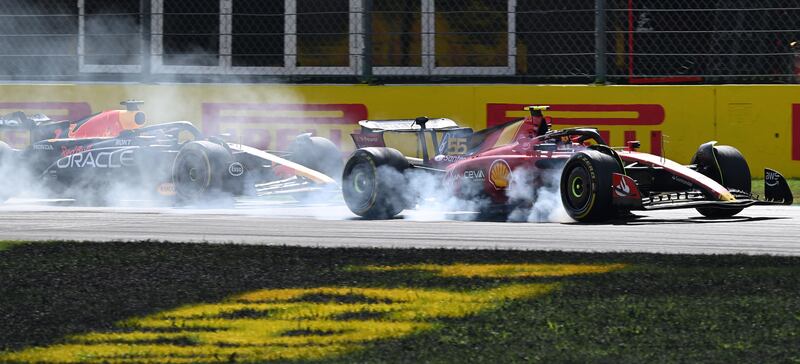 Ferrari's Carlos Sainz overtakes Max Verstappen of Red Bull during the race.   EPA 