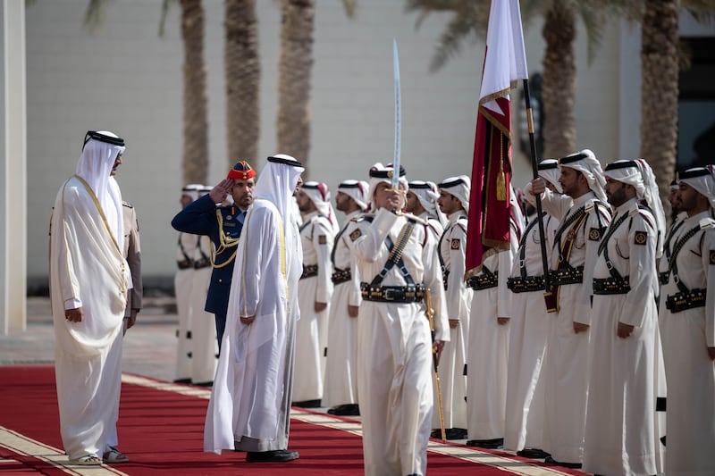 Sheikh Mohamed and Sheikh Tamim inspect the Qatar Guard of Honour. Rashed Al Mansoori / Presidential Court 
