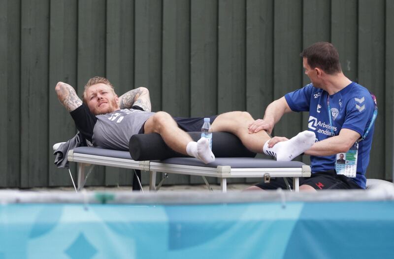 Denmark's Simon Kjaer receives a massage during a training session. Reuters