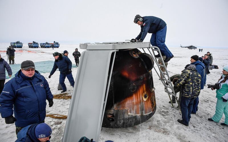 A Search and rescue team works at the landing site of the Soyuz MS-06 space capsule with International Space Station crew members Joe Acaba and Mark Vande Hei of the US, and Alexander Misurkin of Russia in a remote area outside the town of Dzhezkazgan (Zhezkazgan), Kazakhstan. Alexander Nemenov / Reuters