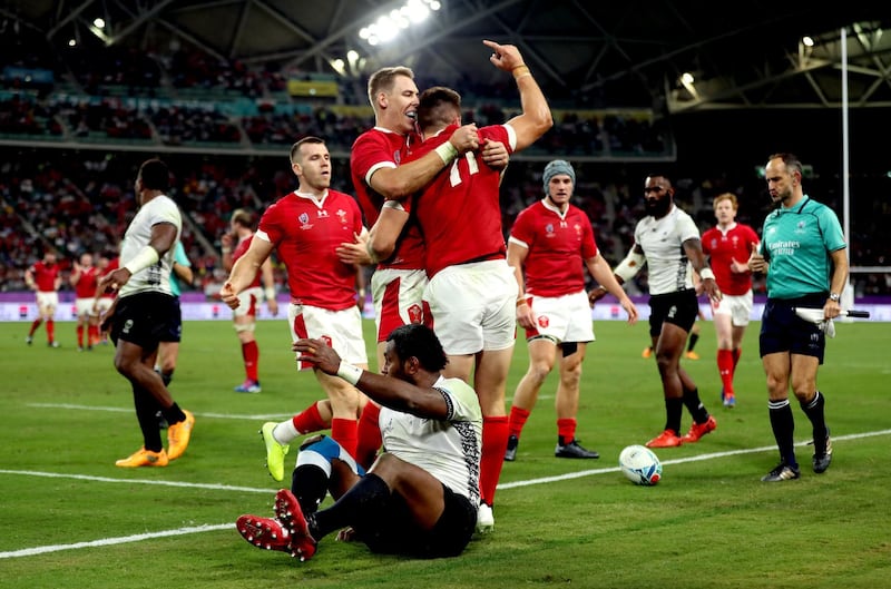 Wales' Josh Adams celebrates scoring his sides third try with his team mates during the 2019 Rugby World Cup Pool D match at Oita Stadium. PA Photo