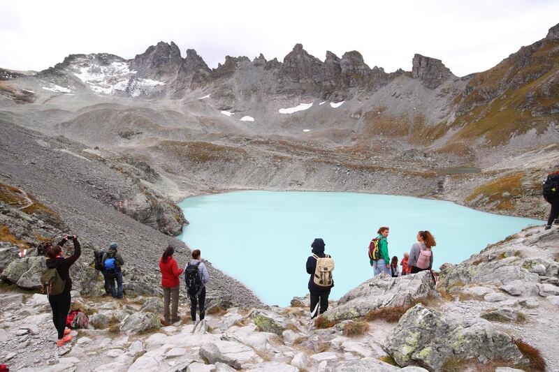 People look at the Pizol glacier as they take part in a mourning ceremony as awareness to climate change, Switzerland. Reuters