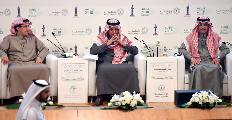 Saudi Finance Minister Mohammed al-Jadaan (R), Minister of Economy and Planning Mohammed al-Tuwaijri (C) and Saudi Arabian Monetary Agency (SAMA) Governor Ahmed al- Khulaifi (L) take part in a press conference during which officials announced the state budget for 2018, in Riyadh, on December 19, 2017.   / AFP PHOTO / FAYEZ NURELDINE