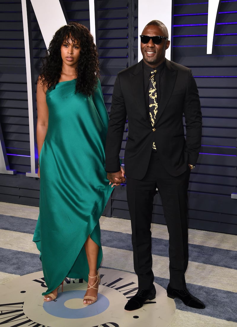 Idris Elba and Sabrina Dhowre arrive at the 2019 Vanity Fair Oscar Party. AP